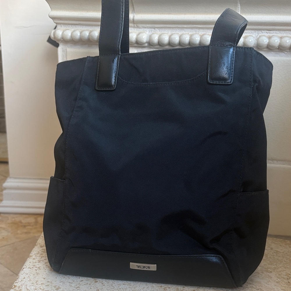 TUMI Black Backpack with Light Blue Interior